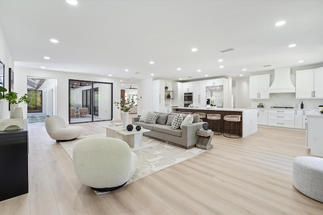 living room with light hardwood / wood-style floors