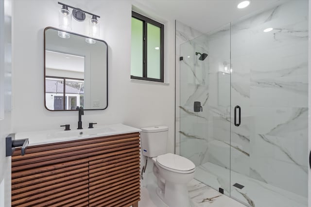 bathroom with toilet, an enclosed shower, and vanity