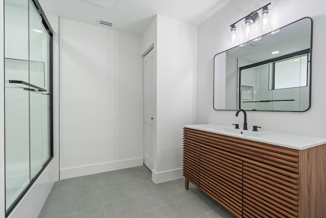 bathroom featuring tile patterned floors and vanity