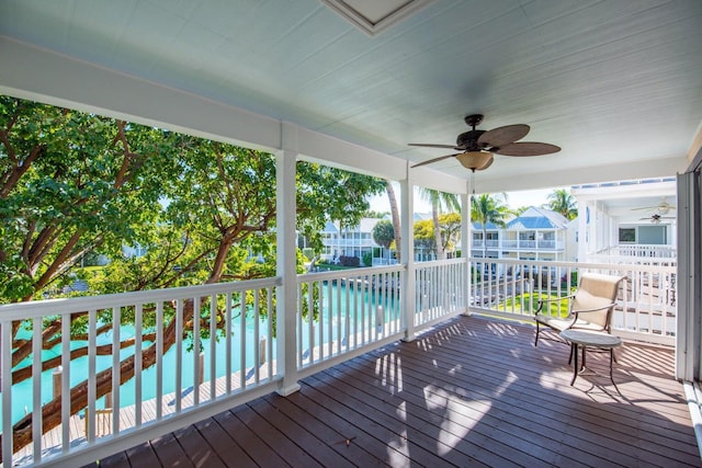 wooden terrace featuring ceiling fan