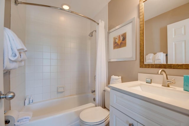 full bathroom with vanity, shower / bath combination with curtain, and toilet