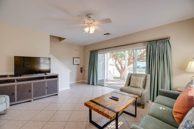 living room with light tile patterned flooring and ceiling fan