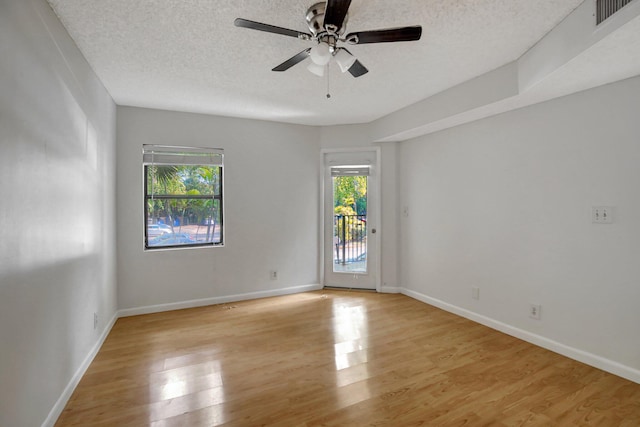 9999 Summerbreeze Dr Unit 1005, Sunrise, FL 33322 - empty room with plenty of natural light, light wood-style flooring, a ceiling fan, and a textured ceiling