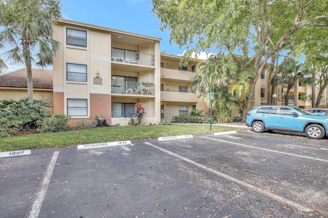 9999 Summerbreeze Dr Unit 1005, Sunrise, FL 33322 - view of apartment building / complex featuring uncovered parking