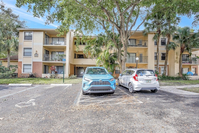 9999 Summerbreeze Dr Unit 1005, Sunrise, FL 33322 - view of apartment building / complex featuring uncovered parking