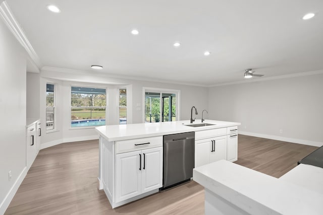 kitchen with dishwasher, sink, ceiling fan, an island with sink, and white cabinetry