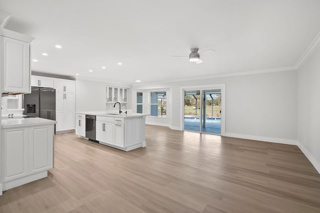 kitchen featuring black dishwasher, white cabinetry, ceiling fan, and sink