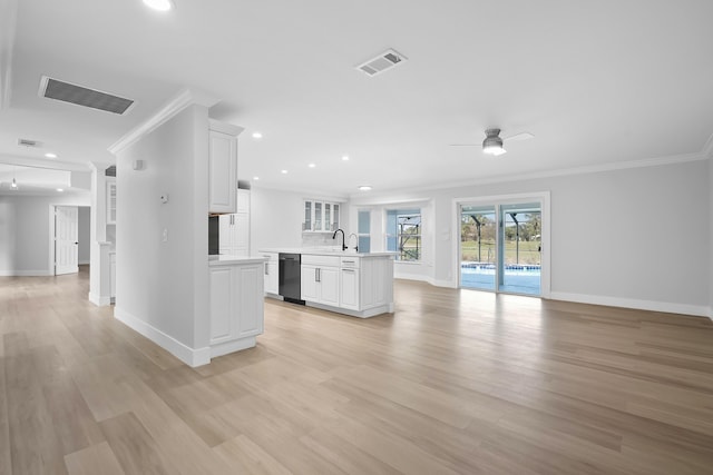 kitchen with white cabinetry, dishwasher, ceiling fan, and ornamental molding