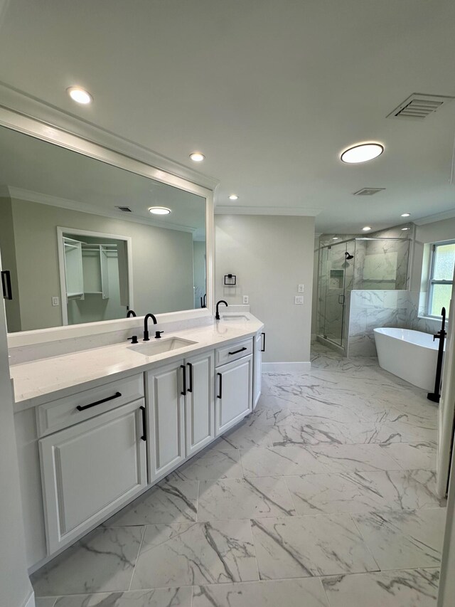 bathroom with crown molding and vanity