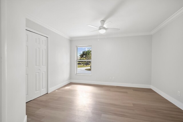 bathroom featuring vanity, toilet, and crown molding