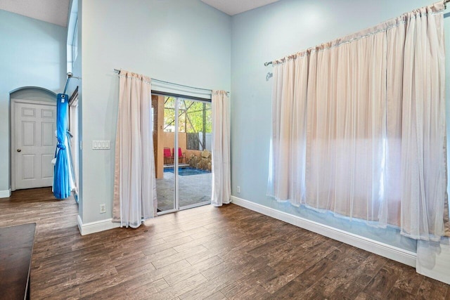 interior space with dark wood-type flooring