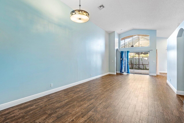 unfurnished living room featuring high vaulted ceiling, a textured ceiling, and dark hardwood / wood-style flooring