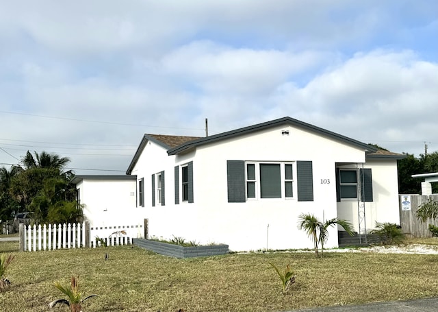 view of side of home featuring a yard