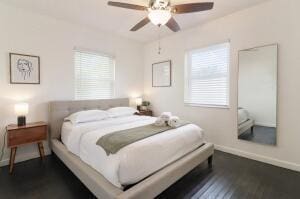 bedroom with ceiling fan and dark hardwood / wood-style flooring