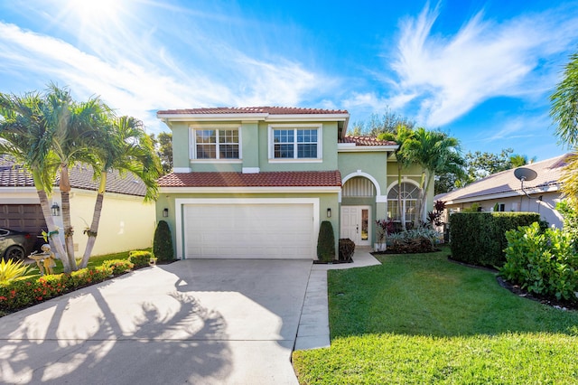 mediterranean / spanish-style home with a garage and a front lawn