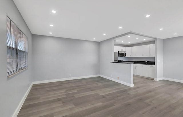 unfurnished living room with light hardwood / wood-style floors