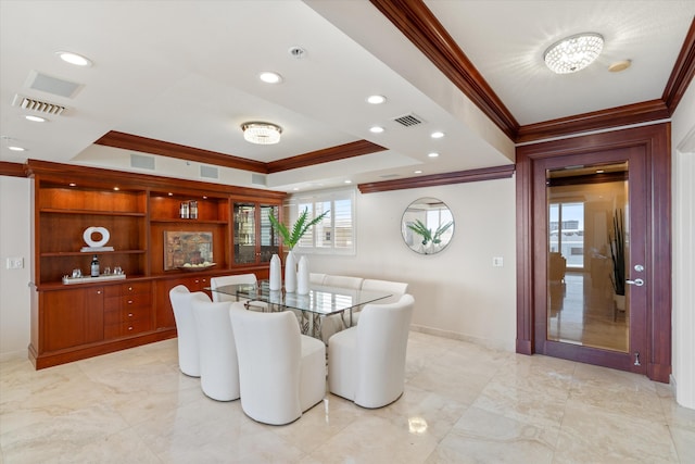 dining area featuring a notable chandelier and ornamental molding