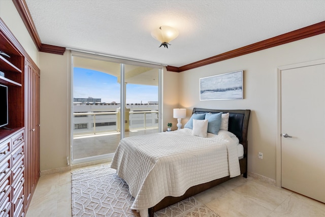 bedroom featuring expansive windows, ornamental molding, and a textured ceiling