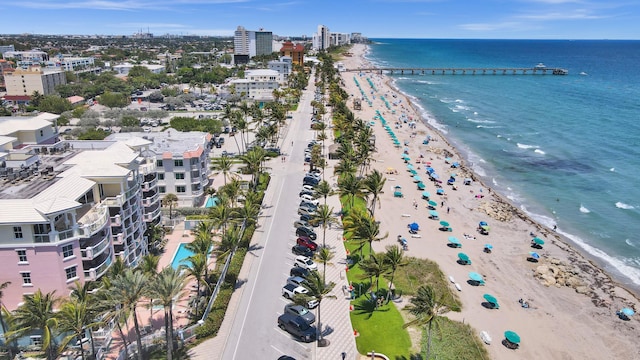 bird's eye view featuring a view of the beach and a water view