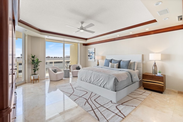 bedroom with a raised ceiling, ceiling fan, a textured ceiling, and ornamental molding