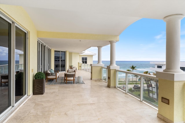 balcony featuring a water view