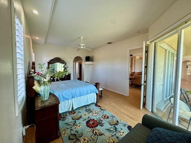 bedroom featuring access to outside, ceiling fan, and light wood-type flooring