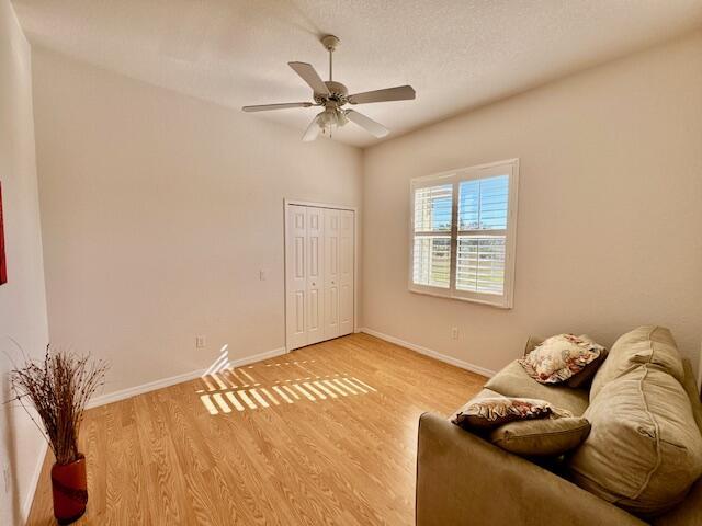 unfurnished room featuring ceiling fan and light wood-type flooring