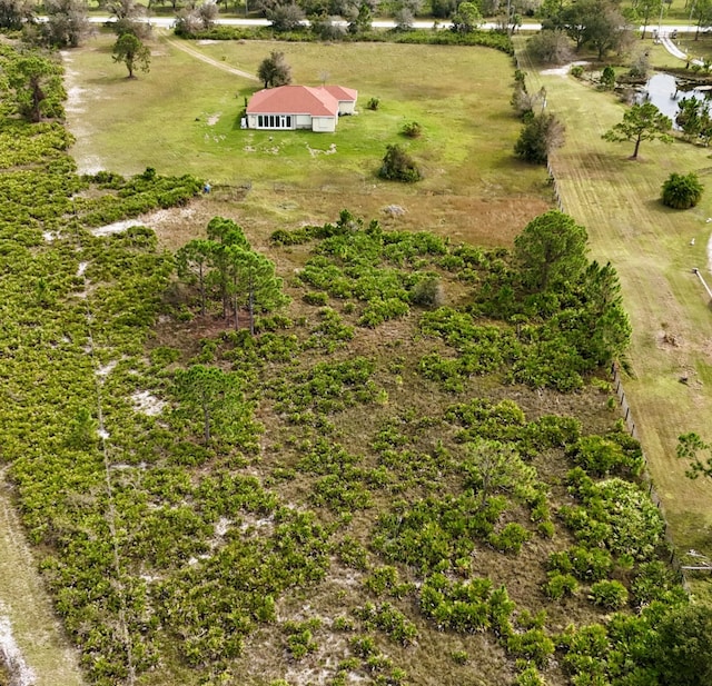 birds eye view of property featuring a rural view