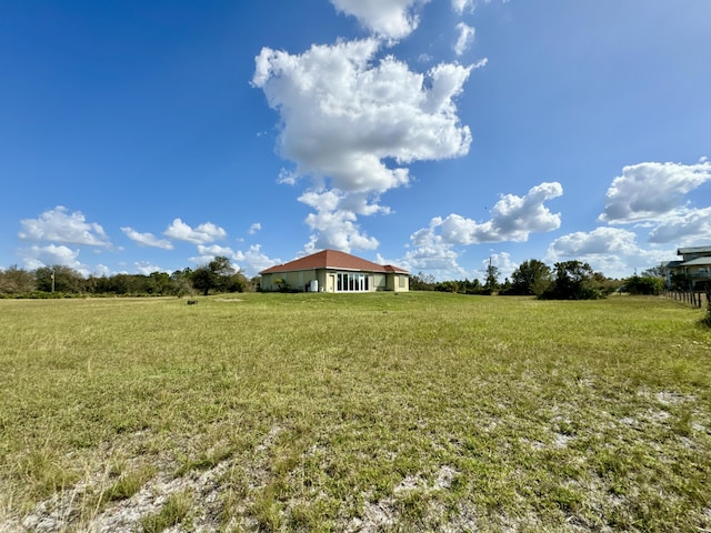 view of yard with a rural view