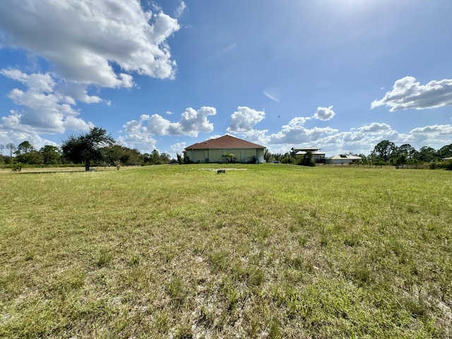 view of yard with a rural view