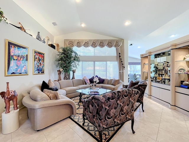 living room with light tile patterned flooring and lofted ceiling