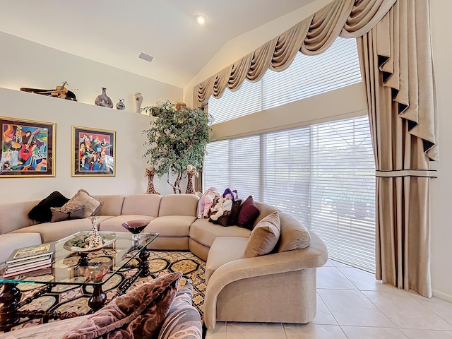 tiled living room with vaulted ceiling