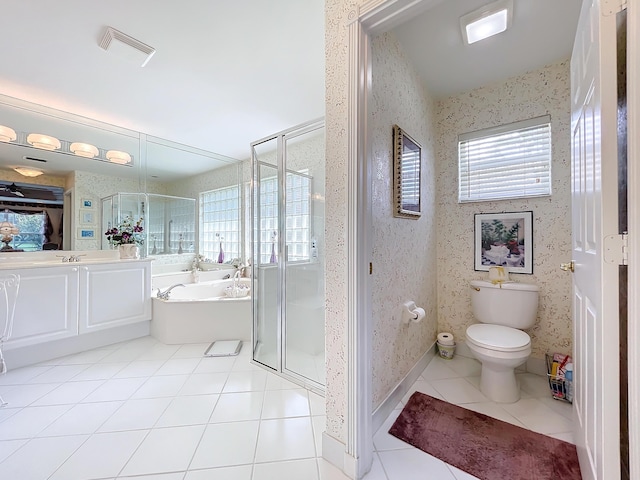 full bathroom featuring tile patterned flooring, vanity, independent shower and bath, and toilet