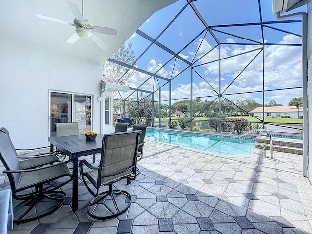 view of swimming pool featuring a lanai, ceiling fan, a patio, and a jacuzzi