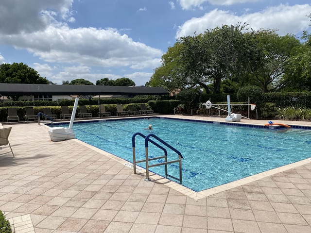 view of pool featuring a patio