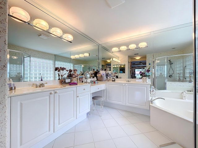 bathroom with separate shower and tub, tile patterned floors, and vanity