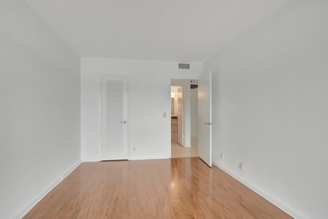 empty room with light wood-type flooring