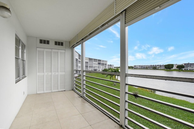 balcony featuring a water view