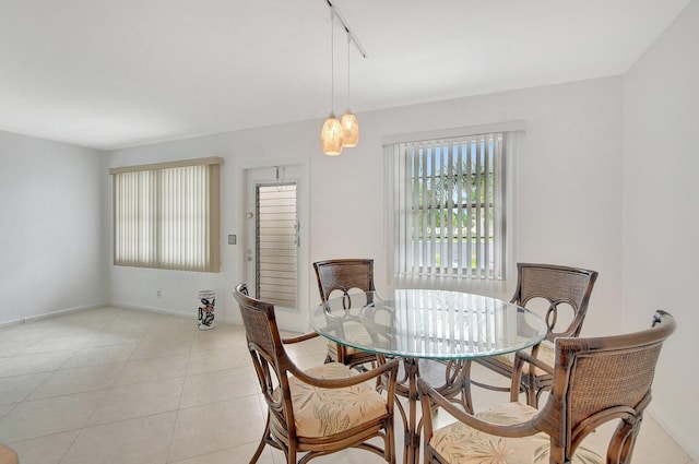 kitchen with a paneled ceiling, sink, light tile patterned floors, and stainless steel appliances