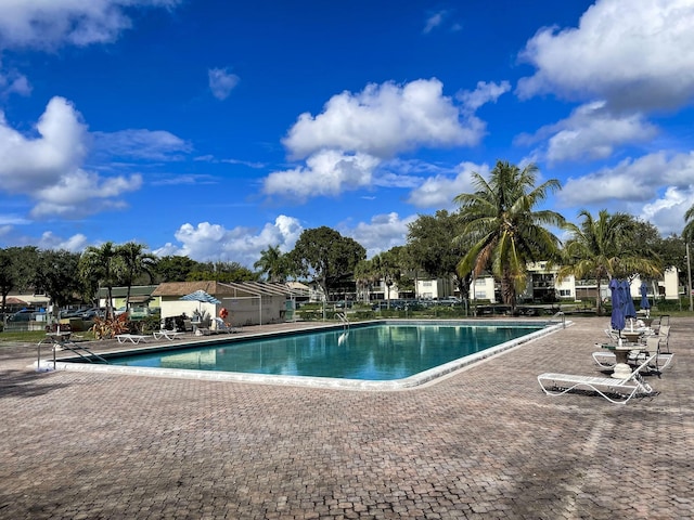 view of swimming pool with a patio area