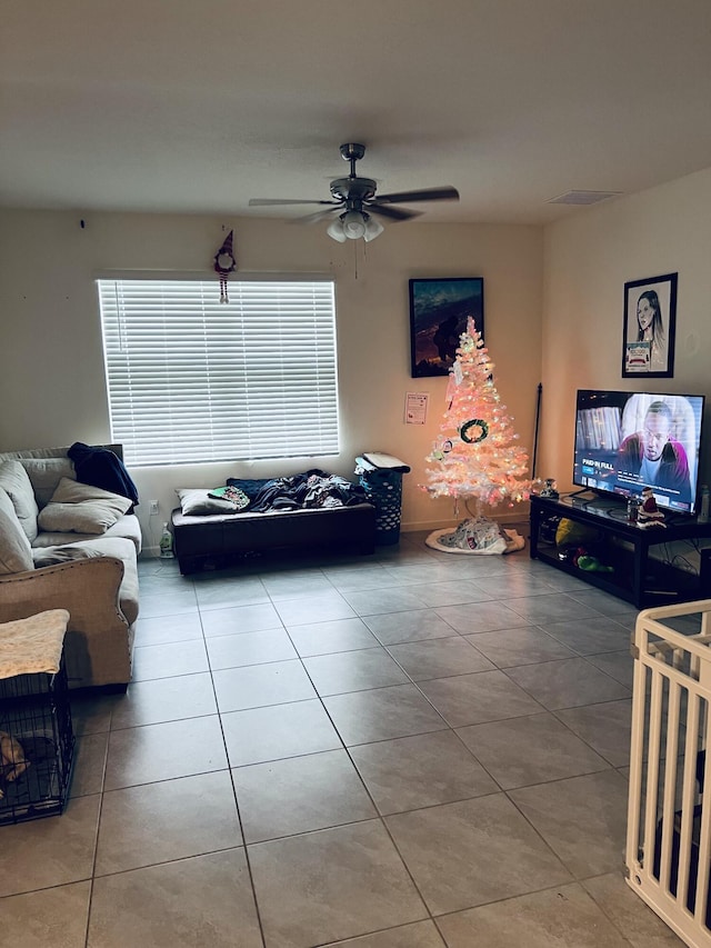 tiled living room with ceiling fan