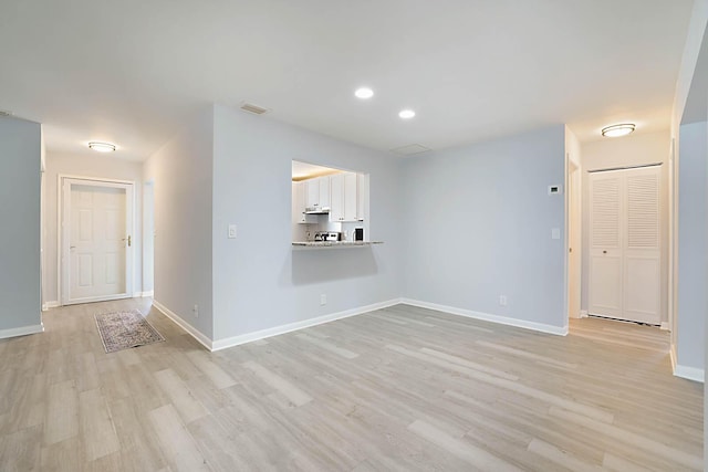 unfurnished living room featuring light hardwood / wood-style floors