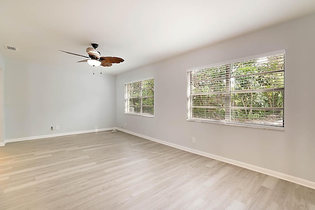 spare room featuring ceiling fan and light wood-type flooring