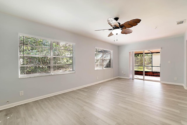 unfurnished room with light hardwood / wood-style flooring and ceiling fan