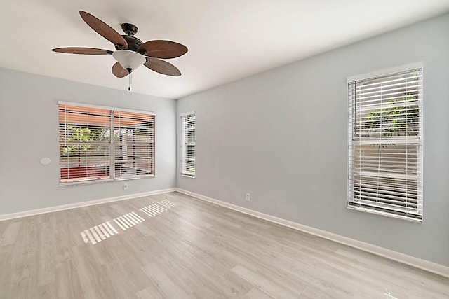 spare room featuring ceiling fan and light wood-type flooring