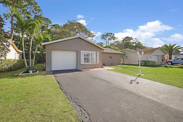 single story home with a garage and a front yard