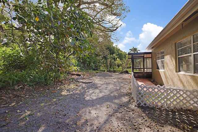 view of yard with a sunroom