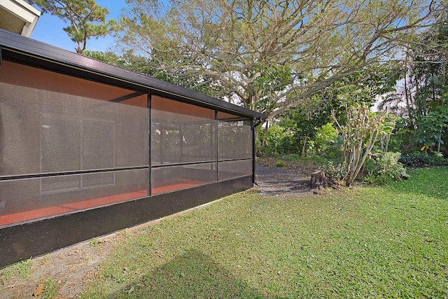 view of yard with a sunroom