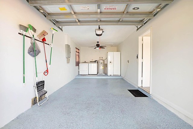 garage with ceiling fan, white fridge with ice dispenser, electric panel, and independent washer and dryer