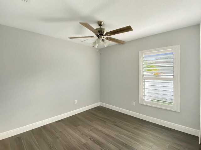 unfurnished room featuring ceiling fan and dark hardwood / wood-style floors